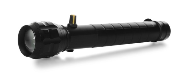 Photo of One modern black flashlight isolated on white