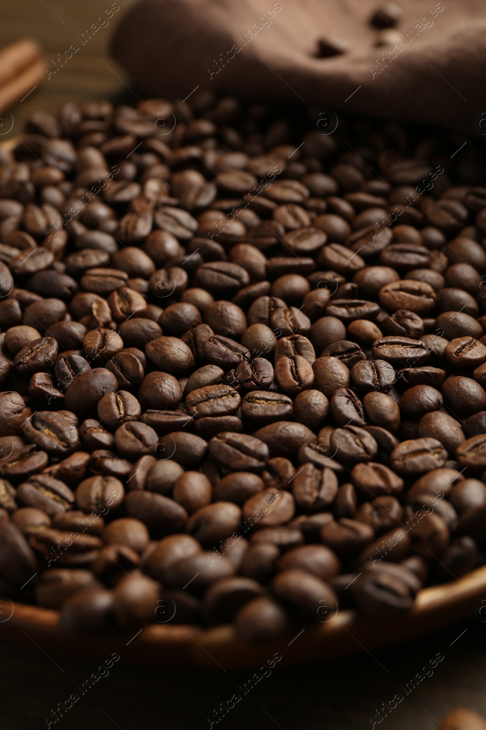 Aromatic coffee beans on table, closeup view Photo of Aromatic coffee beans on table, closeup view