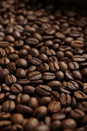 Photo of Aromatic coffee beans as background, closeup view