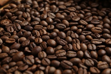 Photo of Aromatic coffee beans as background, closeup view