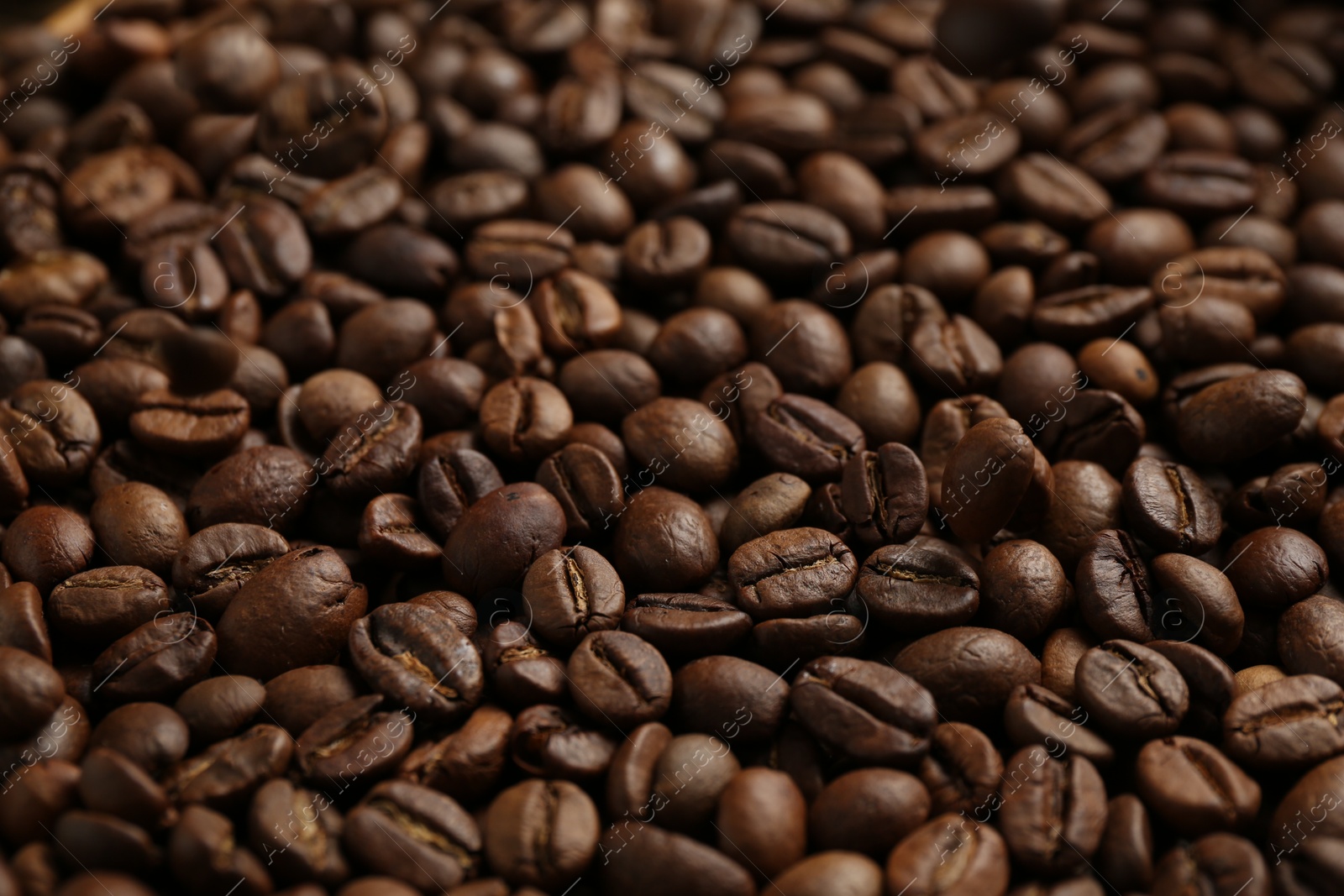 Aromatic coffee beans as background, closeup view Photo of Aromatic coffee beans as background, closeup view