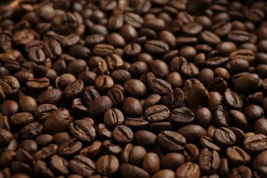 Photo of Aromatic coffee beans as background, closeup view