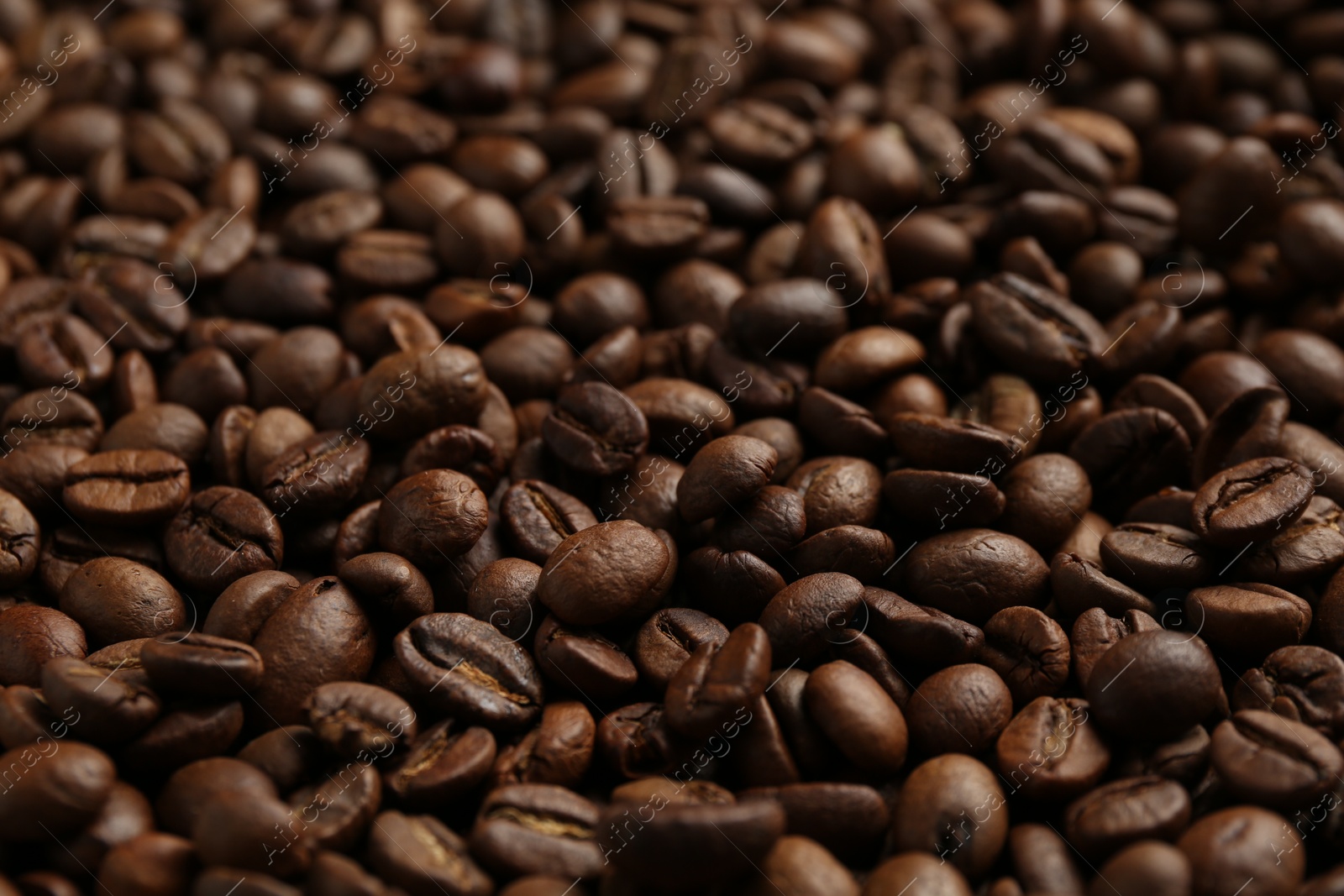 Aromatic coffee beans as background, closeup view Photo of Aromatic coffee beans as background, closeup view