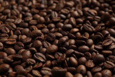 Photo of Aromatic coffee beans as background, closeup view