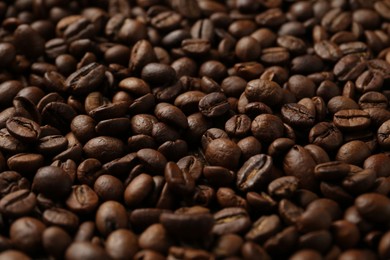 Photo of Aromatic coffee beans as background, closeup view