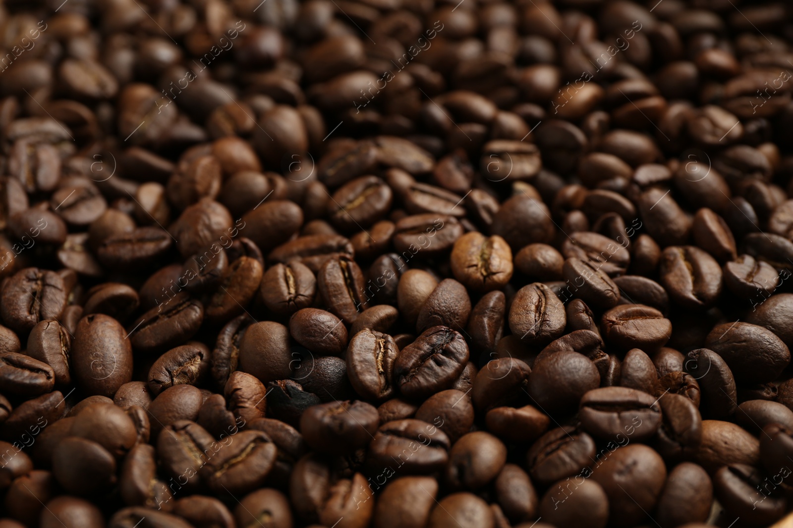 Aromatic coffee beans as background, closeup view Photo of Aromatic coffee beans as background, closeup view