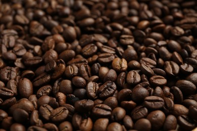 Photo of Aromatic coffee beans as background, closeup view