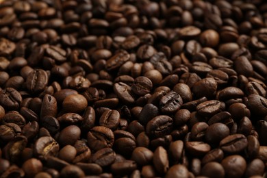 Photo of Aromatic coffee beans as background, closeup view