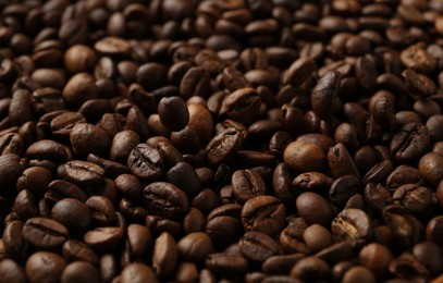Photo of Aromatic coffee beans as background, closeup view