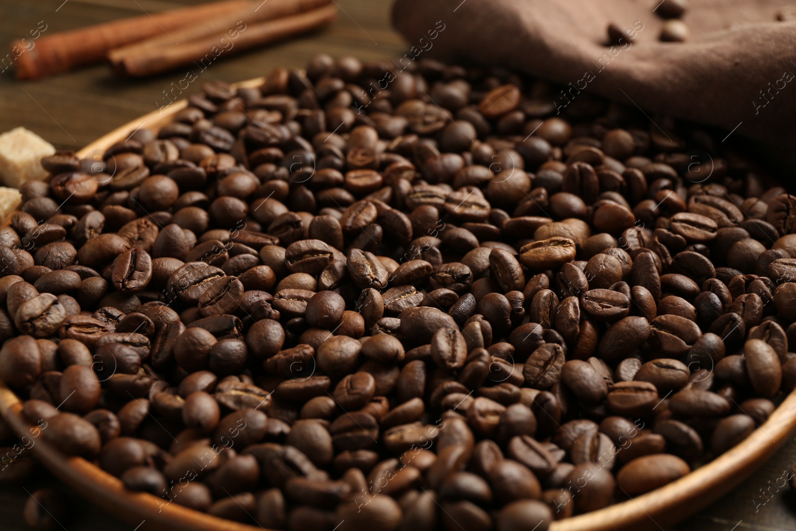 Aromatic coffee beans on table, closeup view Photo of Aromatic coffee beans on table, closeup view