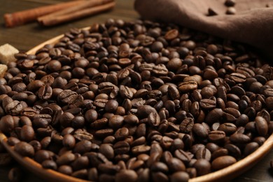 Photo of Aromatic coffee beans on table, closeup view