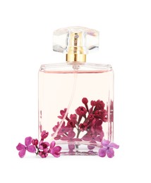 Photo of Bottle of luxury perfume and lilac flowers isolated on white