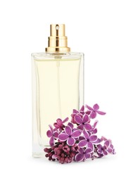 Photo of Bottle of luxury perfume and lilac flowers isolated on white