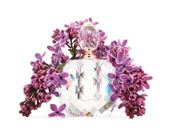 Photo of Bottle of luxury perfume and lilac flowers isolated on white