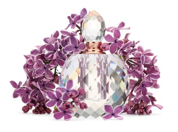 Photo of Bottle of luxury perfume and lilac flowers isolated on white