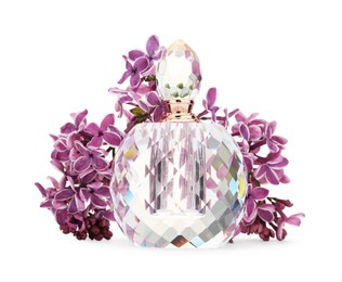 Photo of Bottle of luxury perfume and lilac flowers isolated on white
