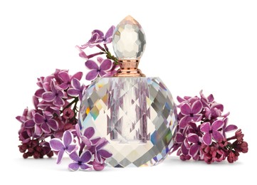 Photo of Bottle of luxury perfume and lilac flowers isolated on white
