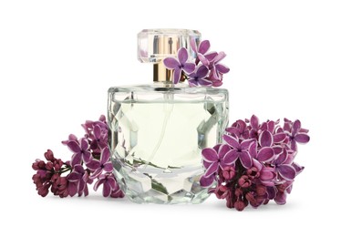 Photo of Bottle of luxury perfume and lilac flowers isolated on white