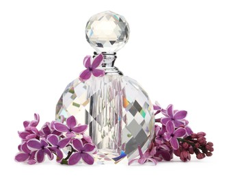 Photo of Bottle of luxury perfume and lilac flowers isolated on white