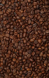 Photo of Aromatic coffee beans as background, top view