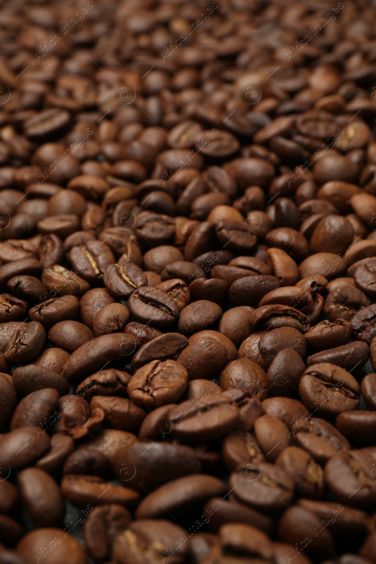 Aromatic coffee beans as background, closeup view Photo of Aromatic coffee beans as background, closeup view