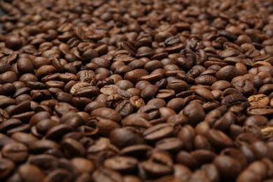Photo of Aromatic coffee beans as background, closeup view