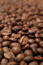 Photo of Aromatic coffee beans as background, closeup view