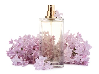 Photo of Luxury perfume and beautiful lilac flowers isolated on white