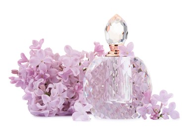 Photo of Luxury perfume and beautiful lilac flowers isolated on white
