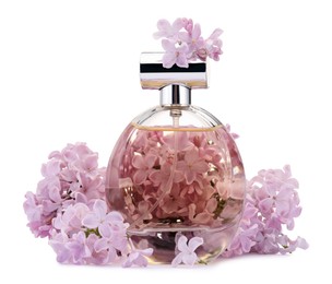 Photo of Luxury perfume and beautiful lilac flowers isolated on white