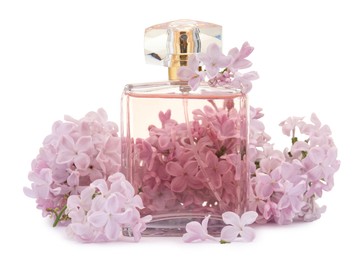 Photo of Luxury perfume and beautiful lilac flowers isolated on white