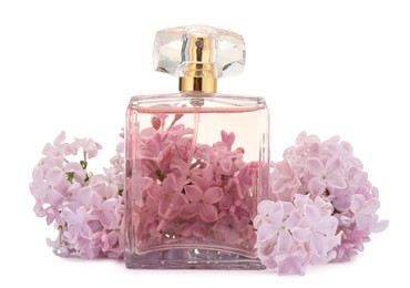 Photo of Luxury perfume and beautiful lilac flowers isolated on white