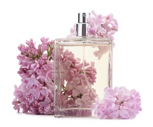 Photo of Luxury perfume and beautiful lilac flowers isolated on white