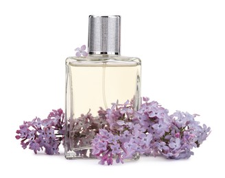 Photo of Luxury perfume and beautiful lilac flowers isolated on white