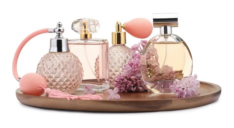 Photo of Luxury perfumes and beautiful lilac flowers isolated on white