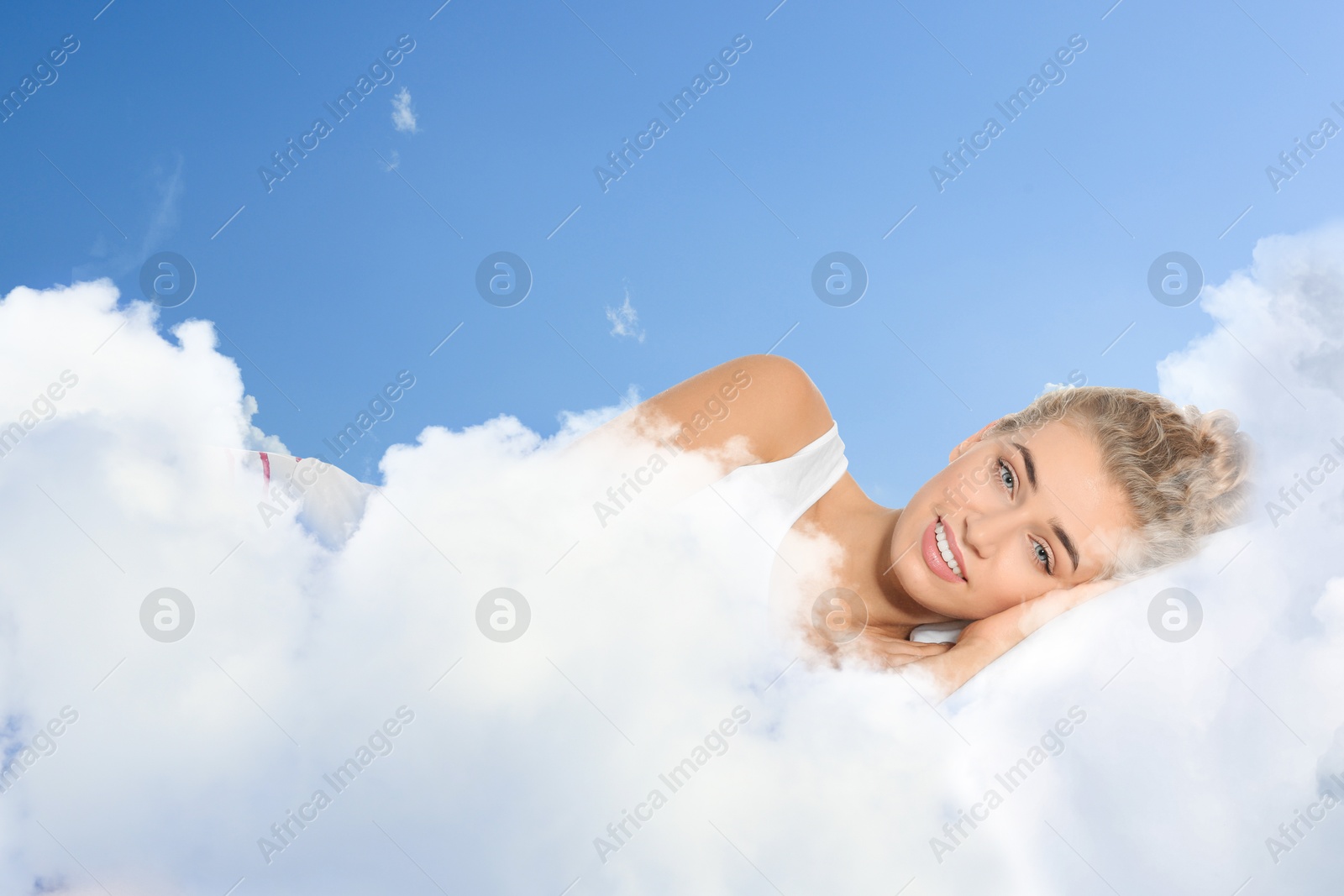 Woman lying on fluffy cloud in blue sky. Bedtime Image of Woman lying on fluffy cloud in blue sky. Bedtime