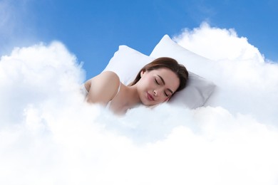 Image of Woman sleeping on fluffy cloud in blue sky. Bedtime