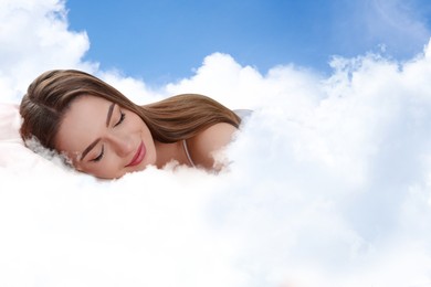 Image of Woman sleeping on fluffy cloud in blue sky. Bedtime