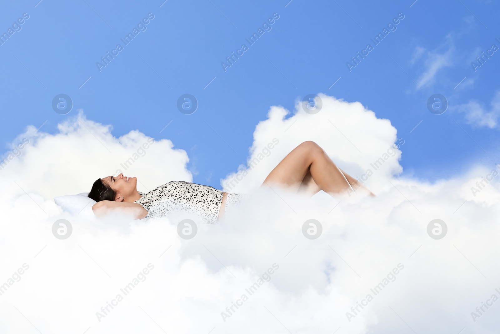 Woman sleeping on fluffy cloud in blue sky. Bedtime Image of Woman sleeping on fluffy cloud in blue sky. Bedtime