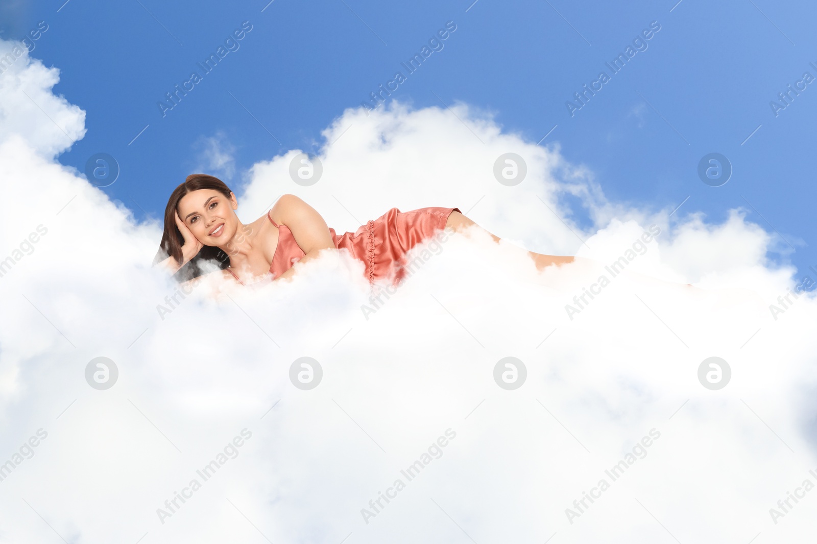 Young woman lying on fluffy cloud in blue sky. Bedtime Image of Young woman lying on fluffy cloud in blue sky. Bedtime