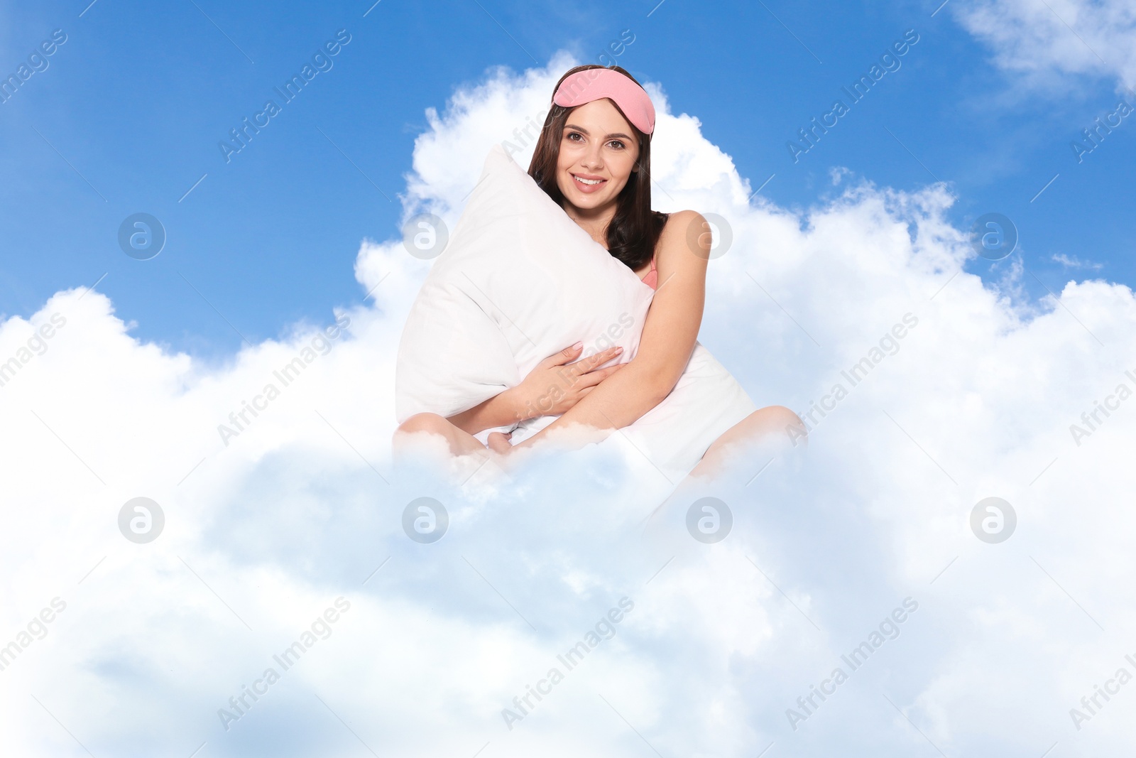 Young woman with sleep mask and pillow on fluffy cloud in blue sky. Bedtime Image of Young woman with sleep mask and pillow on fluffy cloud in blue sky. Bedtime