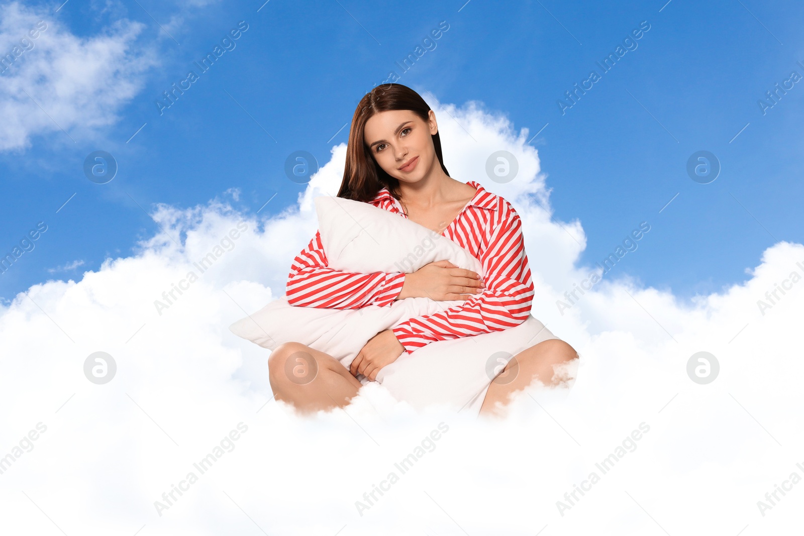 Young woman with pillow sitting on fluffy cloud in blue sky. Bedtime Image of Young woman with pillow sitting on fluffy cloud in blue sky. Bedtime