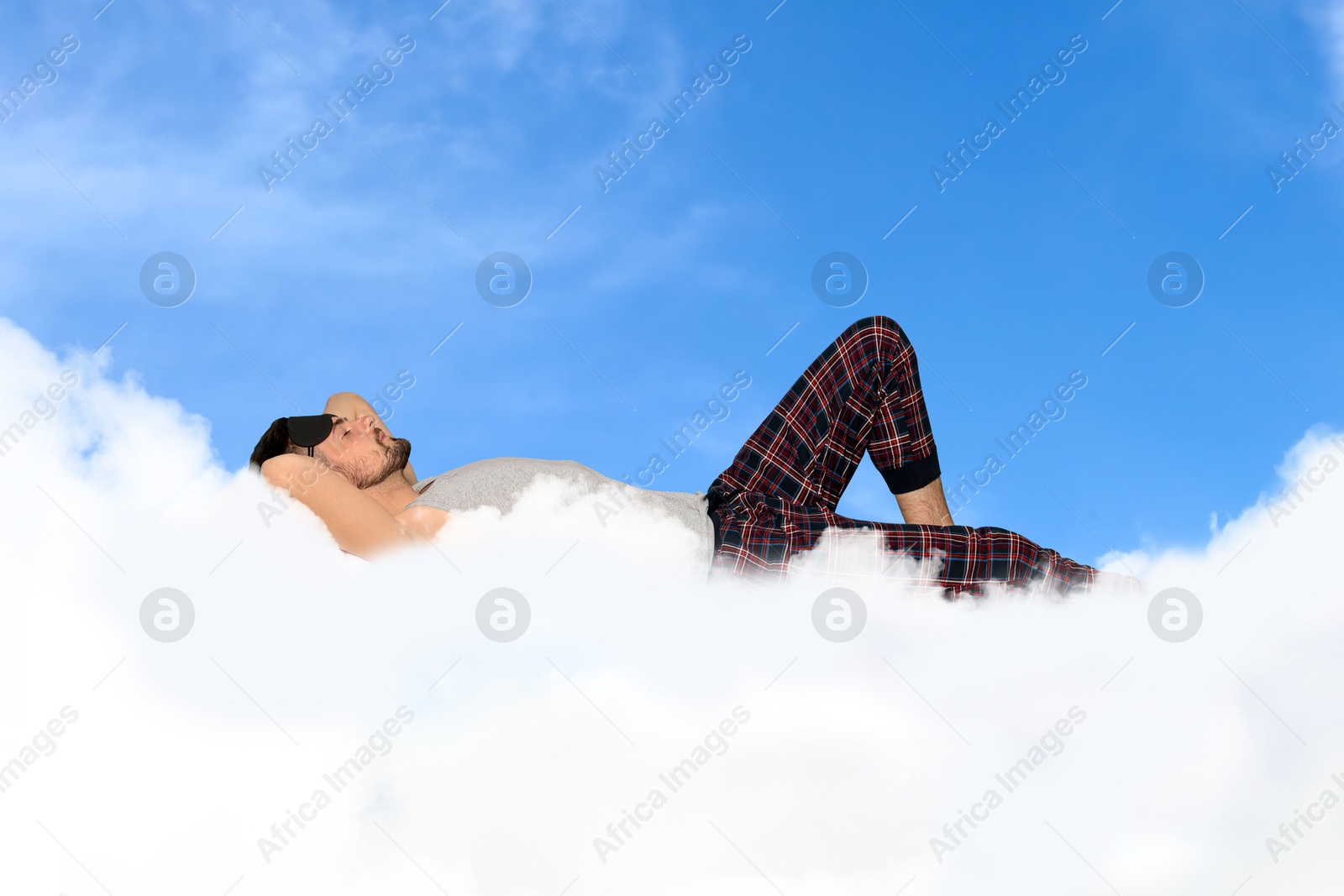 Man sleeping on fluffy cloud in blue sky. Bedtime Image of Man sleeping on fluffy cloud in blue sky. Bedtime