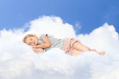 Image of Cute little girl sleeping on fluffy cloud in blue sky. Bedtime