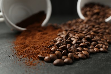 Photo of Aromatic ground coffee and beans on black table, closeup