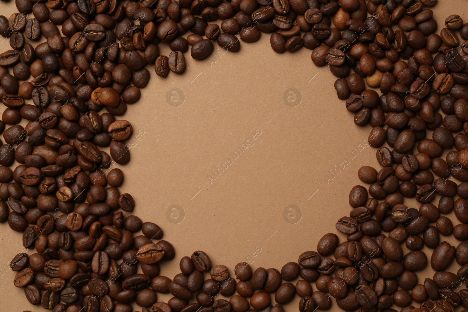 Frame of aromatic coffee beans on beige background, flat lay. Space for text Photo of Frame of aromatic coffee beans on beige background, flat lay. Space for text