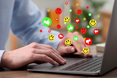 Image of Man using laptop at table, closeup. Social media notifications (likes and emojis) flying out of computer