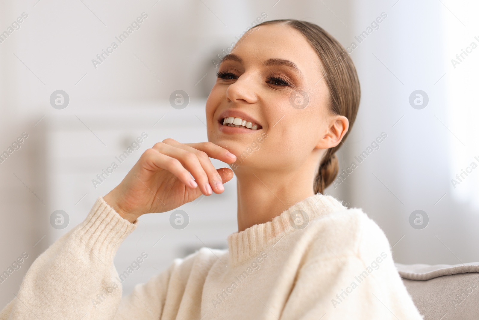 Portrait of beautiful young woman at home Photo of Portrait of beautiful young woman at home