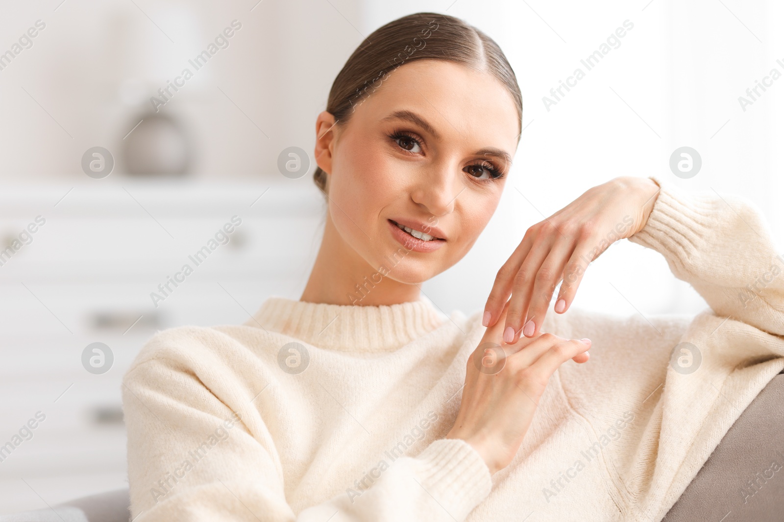 Portrait of beautiful young woman at home Photo of Portrait of beautiful young woman at home
