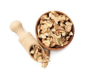 Photo of Pieces of dry chicory roots in bowl and scoop isolated on white, top view